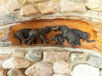 a statue of elephants on a stone wall at 8 person holiday home in Løgstrup-By Traum in Hjarbæk