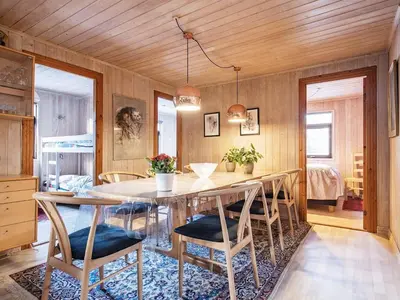 a dining room with a table and chairs at 12 person holiday home in Pandrup-By Traum in Rødhus