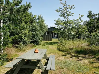 a picnic table with a pot sitting on top of it at 6 person holiday home in Pandrup-By Traum in Rødhus