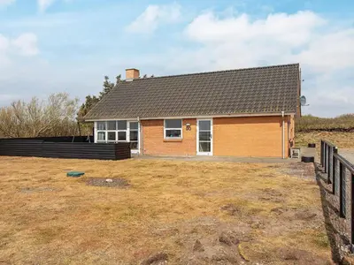 a house with a large yard in front of it at 8 person holiday home in Vestervig-By Traum in Vestervig