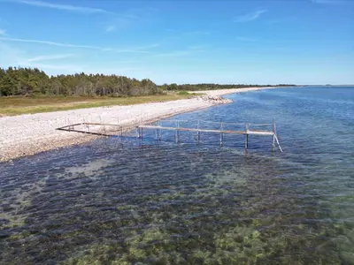a dock in the middle of a body of water at 5 person holiday home in Thyholm-By Traum in Sindrup