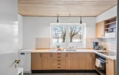 a kitchen with a sink and a window at Lovely Home In Vemb With House Sea View in Vemb