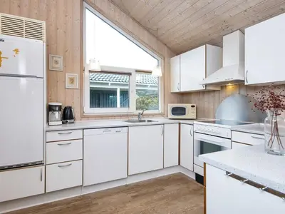 a kitchen with white appliances and a large window at 6 person holiday home in Harboøre-By Traum in Harboør