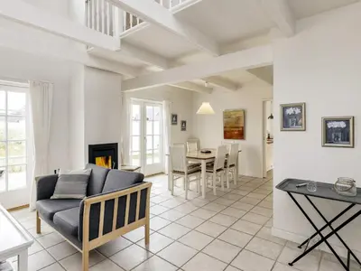 a living room with a couch and a table at 6 person holiday home in Blokhus-By Traum in Blokhus