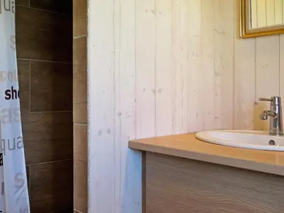 a bathroom with a sink and a shower at 6 person holiday home in Lemvig-By Traum in Trans