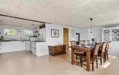 a kitchen and dining room with a table and chairs at Cozy Home In Øster Assels With Wifi in Øster Assels