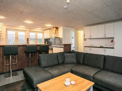 a living room with a couch and a table at 12 person holiday home in Vinderup-By Traum in Vinderup