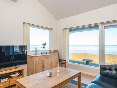 a living room with a view of the ocean at 6 person holiday home in Harboøre-By Traum in Harboør