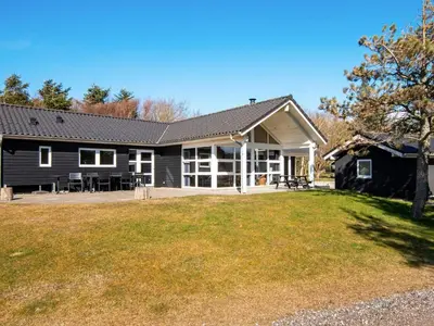 a house with a large yard in front of it at 10 person holiday home in Løgstør-By Traum in Trend