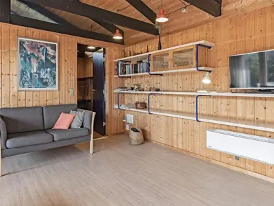 a living room with a couch and a tv at 8 person holiday home in Vestervig in Vestervig
