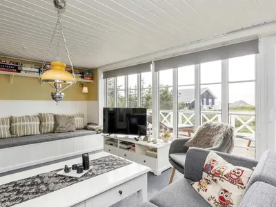 a living room with a couch and a tv at 8 person holiday home in Løgstør-By Traum in Trend