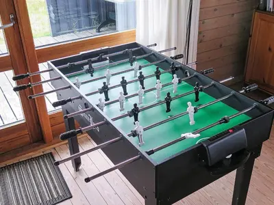 a foosball table with figurines on top of it at Seaside Fun & Relaxation-By Traum in Harboør