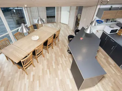 an overhead view of a table and chairs in a kitchen at 10 person holiday home in Harboøre-By Traum in Harboør