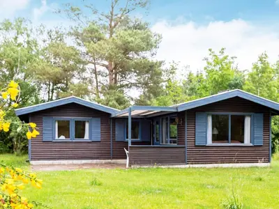 a wooden house with a gambrel roof at 5 person holiday home in Højslev-By Traum in Bøstrup