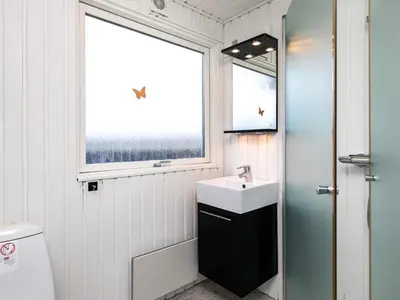 a bathroom with a sink and a window at 6 person holiday home in Vinderup-By Traum in Vinderup