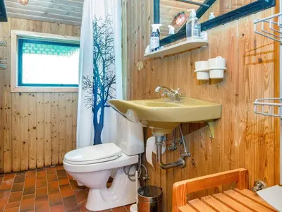 a bathroom with a sink and a toilet at 7 person holiday home in Lemvig-By Traum in Lemvig
