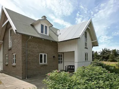 a large brick house with a roof at 5 person holiday home in Harboøre in Harboør