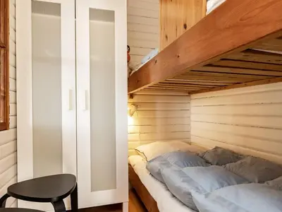 a bedroom with a bunk bed and a staircase at 6 person holiday home in Spøttrup-By Traum in Lihme