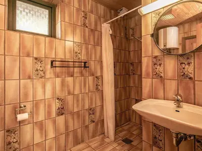 a bathroom with a sink and a mirror at 6 person holiday home in Hurup Thy-By Traum in Sindrup