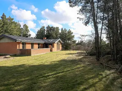 a house with a lawn in front of it at 6 person holiday home in Hurup Thy-By Traum in Sindrup