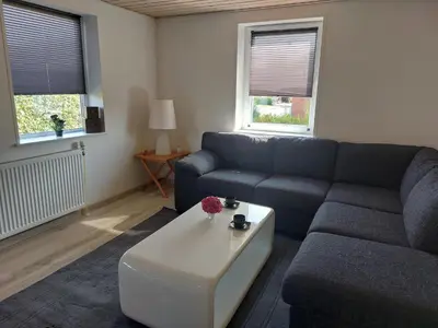 a living room with a couch and a coffee table at Venos Home in Lemvig