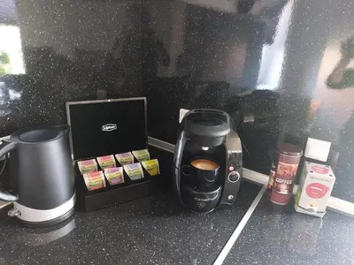 a coffeemaker and a coffee maker on a counter at Venos Home in Lemvig