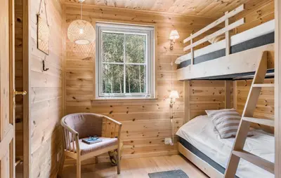 a bedroom with a bunk bed in a cabin at 3 Bedroom Gorgeous Home In Skals in Skals