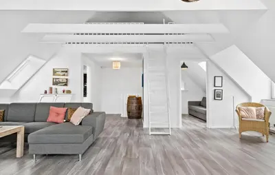 a living room with a couch and a table at Stunning Home In Harboøre With Wifi in Harboør