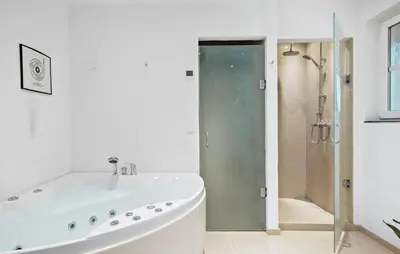 a white bathroom with a tub and a shower at Stunning Home In Harboøre With Wifi in Harboør