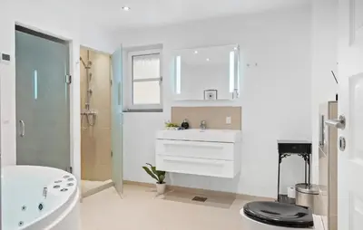 a bathroom with a sink and a toilet and a tub at Stunning Home In Harboøre With Wifi in Harboør