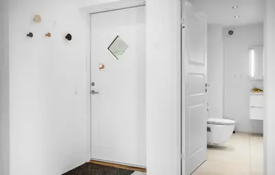 a white bathroom with a toilet and a glass door at Lovely Home In Harboøre With Wifi in Harboør