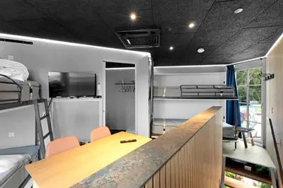 a room with a desk and bunk beds at Funart 3 in Pandrup