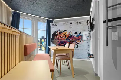 a dining room with a table and chairs at Funart 10 in Pandrup