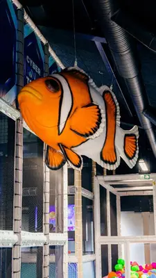 a large orange and white fish hanging from a ceiling at Funart 15 in Pandrup