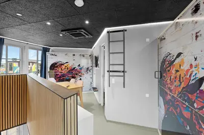 a room with a table and a painting on the wall at Funart 9 in Pandrup