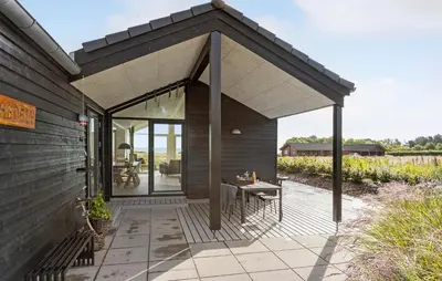 a glass extension of a house with a patio at Beautiful Home In Nykøbing M With Wifi in Alsted