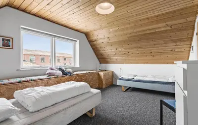 a bedroom with two beds and a wooden ceiling at Lovely Home In Bøvlingbjerg With Wifi in Bøvlingbjerg