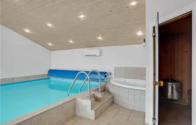 a large swimming pool with a tub in a room at 3 Bedroom Amazing Home In Vinderup in Vinderup