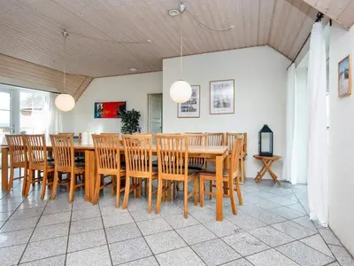 a dining room with a table and chairs at Luxury Beach Retreat - By Traum Ferienwohnungen in Harboør