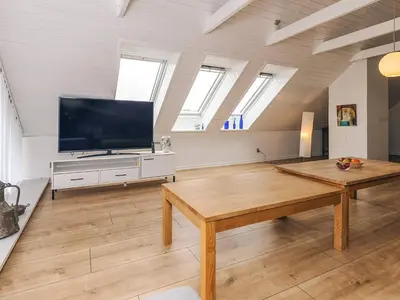 a living room with a large flat screen tv at Seaside Escape with Views - By Traum Ferienwohnungen in Vestervig