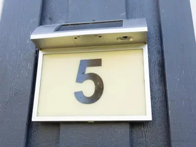a number sign on the side of a building at Family Beach Retreat - By Traum Ferienwohnungen in Løgstør
