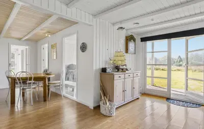 a dining room with a table and a dining room table at 3 Bedroom Beautiful Home In Roslev in Roslev