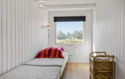 a white room with a couch and a window at 3 Bedroom Beautiful Home In Roslev in Roslev