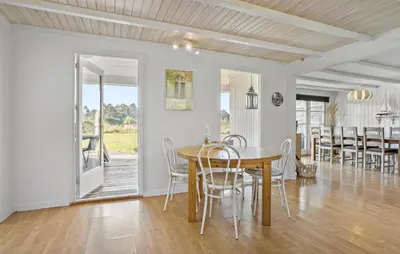 a dining room with a table and chairs at 3 Bedroom Beautiful Home In Roslev in Roslev