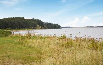 a large body of water with a boat in it at 3 Bedroom Beautiful Home In Thyholm in Thyholm