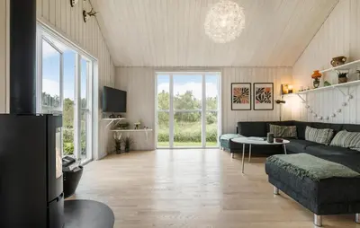a living room with a couch and a table at Beautiful Home In Farsø With Wifi in Farsø