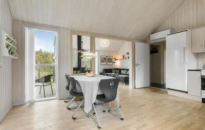 a kitchen and dining room with a table and chairs at Beautiful Home In Farsø With Wifi in Farsø