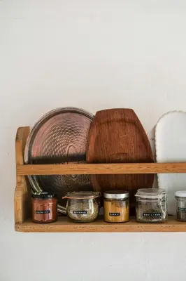 a wooden shelf with jars and a hat on it at Summer House For The Big Family Close To The Fjord in Agger