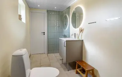 a bathroom with a toilet and a sink and a shower at 2 Bedroom Nice Home In Thisted in Thisted