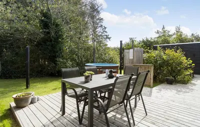 a table and chairs on a wooden deck at Pet Friendly Home In Spøttrup With Wifi in Spottrup